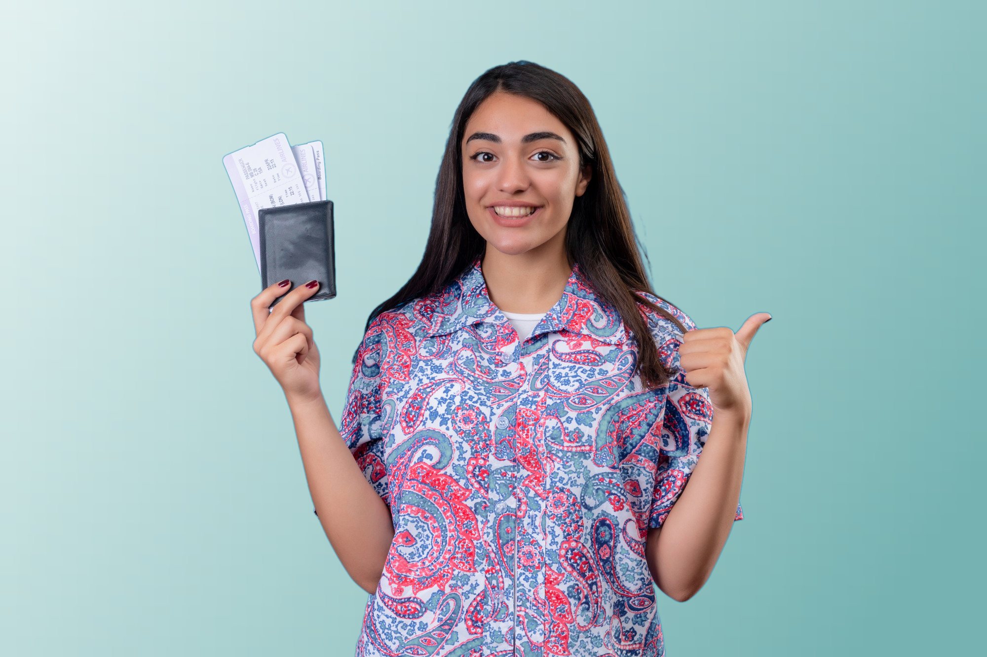 A smiling student holding a passport and boarding passes, giving a thumbs-up